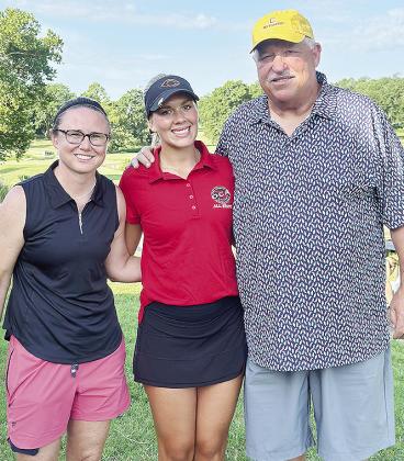 Grace Meacham, center, celebrates her All-State appearance Monday at Cherokee Hills Golf Club in Catoosa with current Clinton Lady Reds’ Golf Coach Tasha Marshall, left, and former golf coach Mike Lee. CDN | Courtesy Photo