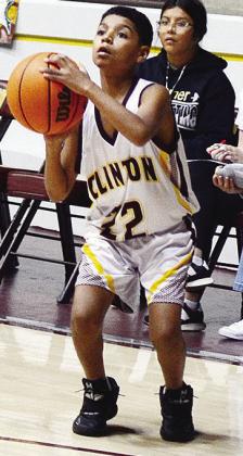 No. 22 TJ Perez prepares to shoot the ball as he stares down the basket during Clinton’s seventh-grade boys’ game against Woodward. CDN | Sam Goodwyn