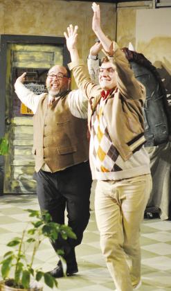 Mr. Mushnick (Christopher Curtis), left, and Seymour (Wesley Javorsky) dance with joy at the thought of adoption during “Little Shop of Horrors” at the Southwest Playhouse. CDN | Staff Photo