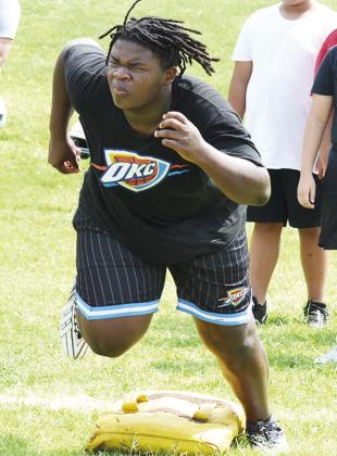 CDN |Sam Goodwyn Jayden McCoy shoots out of his lineman stance as a part of a drill last week during practice.