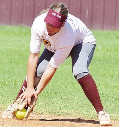 Stella Meacham fields the ball during a preseason practice at the softball field. CDN | Sam Goodwyn
