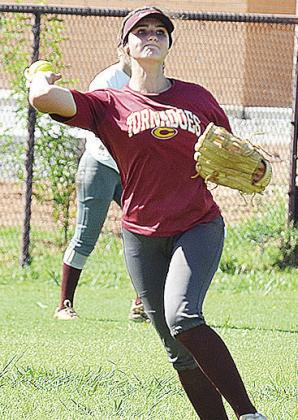 Clinton’s Reece Giblet throws the ball across the field during a preseason practice at the softball field. CDN | Sam Goodwyn