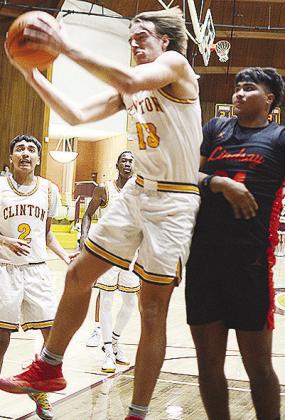 Clinton’s Ethan Lofland catches the rebound against the Lindsay defender during the Reds’ game this weekend. CDN | Sam Goodwyn