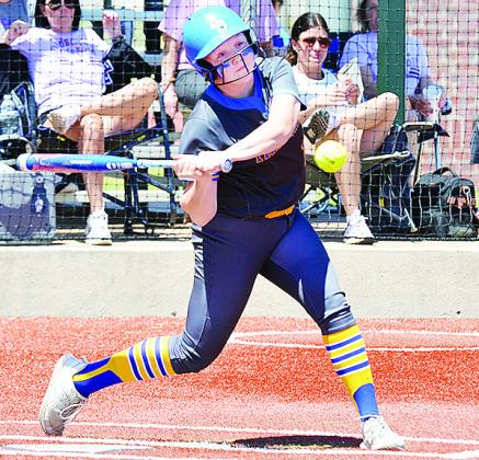 No. 13 Lauryn McHenry focuses on the ball as she prepares to swing at it during the regional tournament in Elk City during the spring season. CDN | Sam Goodwyn