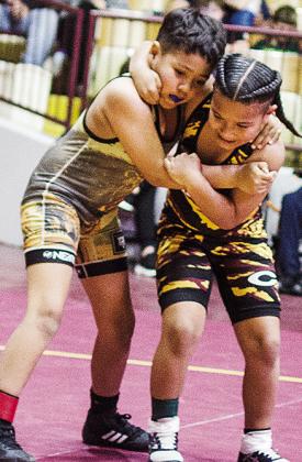 Otha Douglas Jr., right, grapples with his opponent during the Clinton Hub City Peewee Classic Wrestling Tournament at the Tornado Dome. CDN |Sam Goodwyn