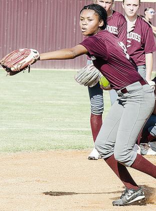 Clinton’s Lyric Davis aims the ball as she prepares to throw it during warm-ups leading up to the softball scrimmage. CDN |Sam Goodwyn