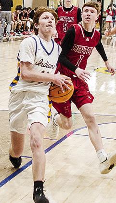 Arapaho-Butler’s Ashton Talcott focuses on the rim as he outraces a Hinton defender during the Indians’ win Tuesday at home over the Comets. CDN | Sam Goodwyn