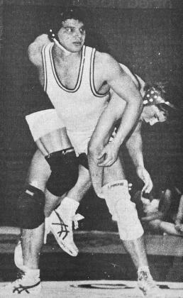 40 YEARS AGO With opponent Randall Base of Geary draped around him like a mink stole, Clinton’s Danny Hendrix looked to coach Robert Roshell for advice in a dual match.