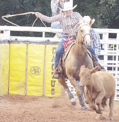 El Reno’s Rachel Ellis blasts out the gate in last year’s rodeo as she participates in the breakaway roping event at the Clinton Rodeo Arena. CDN | Sam Goodwyn