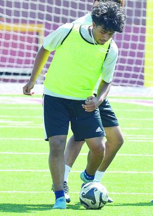 Clinton’s Cristian Nunez dribbles the ball during a practice in the Tornado Bowl. CDN | Sam Goodwyn