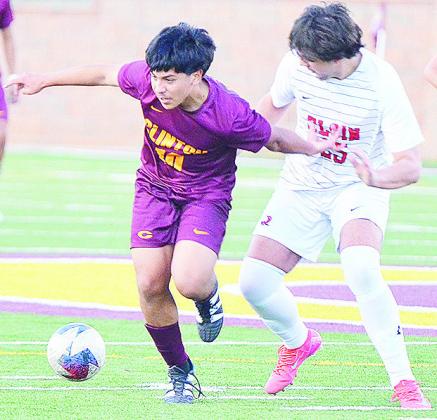 Clinton’s Lino Martinez fights off an Elgin defender for control of the ball during the Red Tornadoes’ win over the Owls in the Tornado Bowl. CDN | Sam Goodwyn