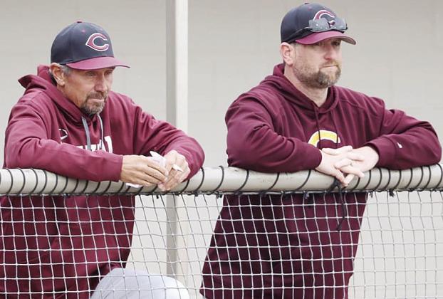 Clinton’s longtime baseball coach Kelly Gaunt, left, and assistant coach Jeff King watch during a baseball game. CDN | Steve Wheeler