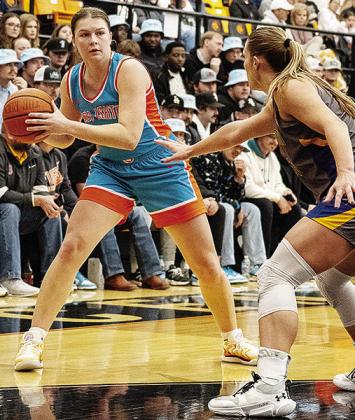 Former Arapaho-Butler Lady Indian Katie Edelen looks for an open teammate during an East Central game this season. CDN | Courtesy Photo