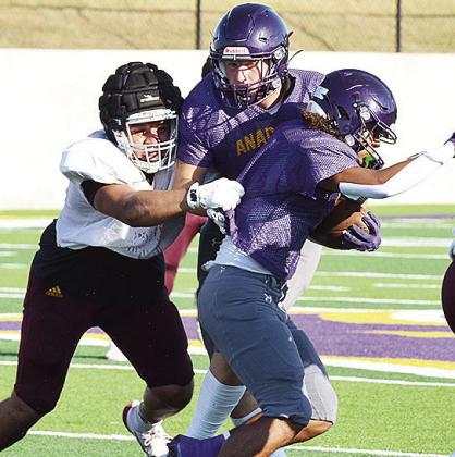 Alex Amaya manages to grab ahold of the Anadarko ballcarrier during Clinton’s scrimmage against the Warriors Friday. CDN | Sam Goodwyn