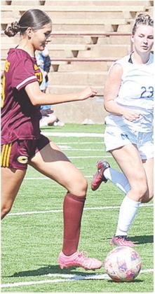 Arianna Venegas races against a Newcastle player during the Lady Reds’ JV game against the Racers. CDN | Sam Goodwyn