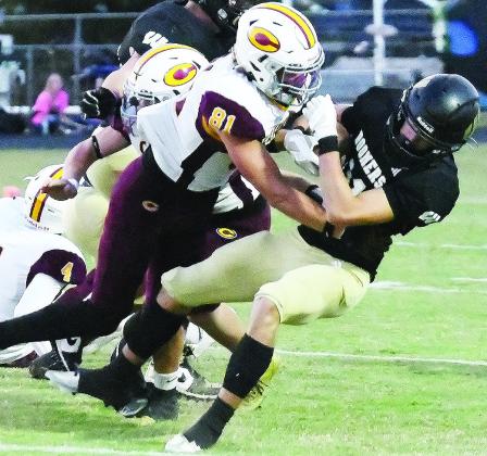 Clinton’s Ben Daugherty levels the Woodward ballcarrier during the Red Tornadoes’ win over the Boomers Thursday in Woodward. CDN | John Kinsey