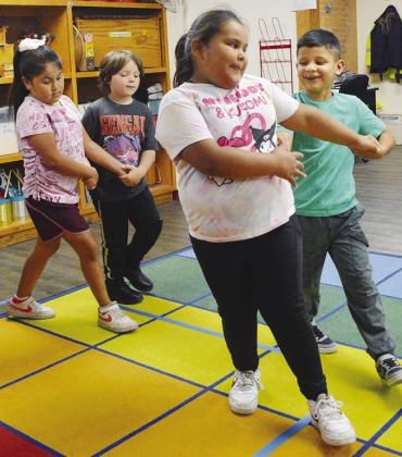 Students practicing square dancing in music class at Nance Elementary, from left are Adeleigh Rios, Asher LaRocco, Harlee French, and Mateo Galvan. CDN | Christian Jacobsen