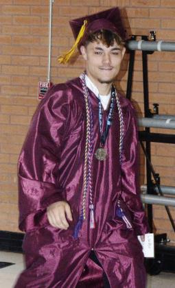 Landon Wilson heads toward center court for his graduation ceremony at the Tornado Dome. CDN | Christian Jacobsen