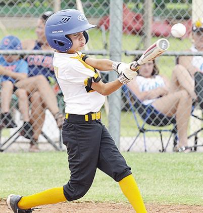 Anderson McCamey of the Alva Gold Sox sends the ball flying during his at bat against the Sallisaw Cubs Thursday to open the 2025 OK Kids 8U Baseball State Tournament at Schumacher Fields at Acme Brick Park. CDN | Sam Goodwyn