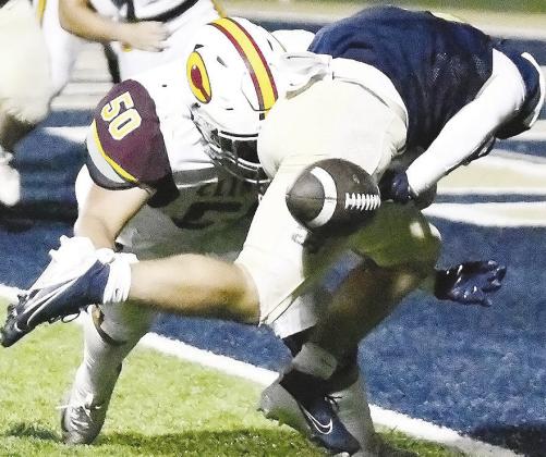 Clinton’s No. 50 Alex Amaya forces a fumble at the goal line during the Red Tornadoes’ road loss Friday to Kingfisher. CDN | John Kinsey