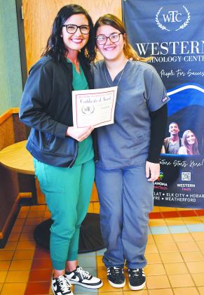 WTC Health Careers Instructor Kylee Chapman, left, presents the Outstanding Studebt of the Year Award to Nataly Rosales of Clinton High School. CDN | Courtesy photo