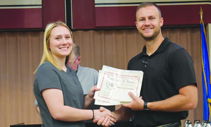 WTC Director of Student Services Zane Trammell, right, presents the Outstanding Studebt of the Year Award to Algebra II student Makenzie Chastain of Arapaho-Butler High School. LPXLP