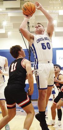 No. 50 Cruze Bittle rises above a Cheyenne- Reydon defender for the basket during Corn Bible’s game against the Bears. CDN | Sam Goodwyn