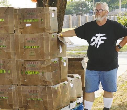 Mike Watson is ready to help anybody wanting packages of fresh celery at the Mission House Kitchen. CDN | Christian Jacobsen