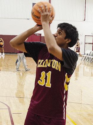 Julian Calixto begins to shoot the ball during the high school practice in the practice gym. CDN |Sam Goodwyn