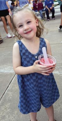 Evie Kliewer enjoys some cool Italian ice recently at the Clinton Farmers Market in Engleman Park. CDN | Courtesy photo