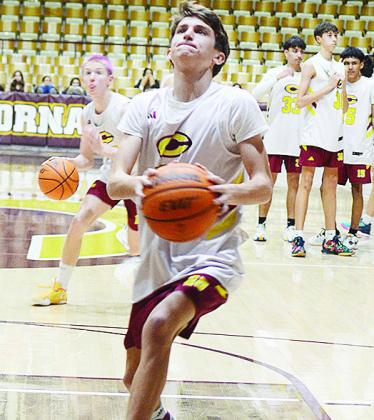 Clinton’s Snider Dowdell goes for the layup during warmups prior to the Reds’ JV game against Bethany. CDN | Sam Goodwyn