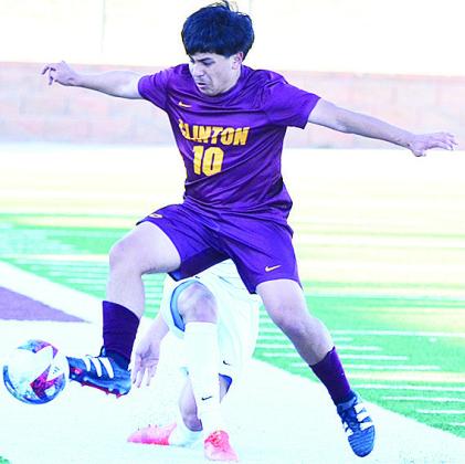 Clinton’s Lino Martinez gets to the ball before the Elgin player during the Reds’ home game against the Owls. CDN | Sam Goodwyn