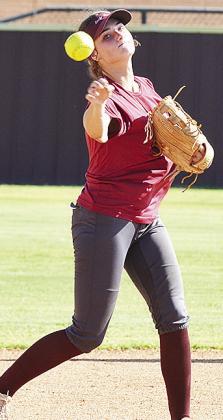 Clinton’s Reece Giblet throws the ball during a softball practice. CDN | Sam Goodwyn