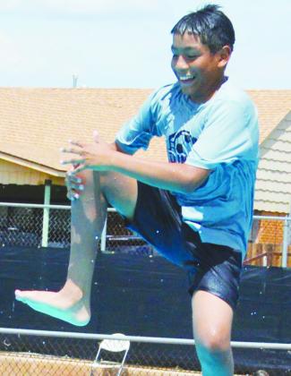 Omar Macias aims to do a zipper dive into the Clinton Public Pool. CDN | Christian Jacobsen