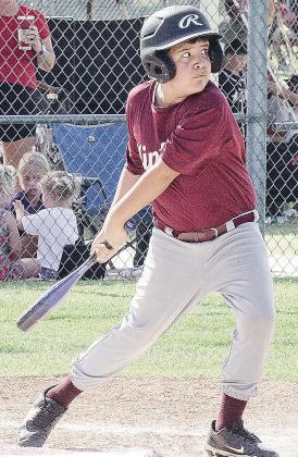 Santiago Vazquez keeps his eye on the ball during Clinton’s baseball game in the OK Kids 8U Baseball State Tournament at Schumacher Fields at Acme Brick Park. CDN |Sam Goodwyn