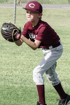 Mark Misak prepares to throw the ball during Clinton’s baseball game in the OK Kids 8U Baseball State Tournament. CDN |Sam Goodwyn