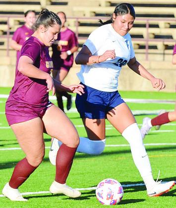 Clinton’s Lexie Conway, left, races against a Putnam City West player as she looks to score during the Lady Reds’ win in the Tornado Bowl. CDN | Sam Goodwyn