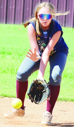 Madison Walker gets in front of the ball to collect it in a fielding drill during practice. CDN | Sam Goodwyn