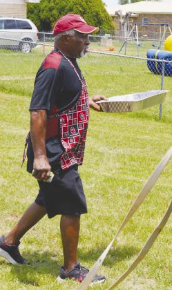 Joe McBrayer is helping serve and prepare food for the Juneteenth celebration at Bethany Baptist Church.
