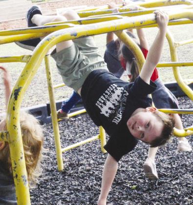 Jimi Haag stated he could hang upside down on the monkey bars, and then immediately did it at Nance Elementary.