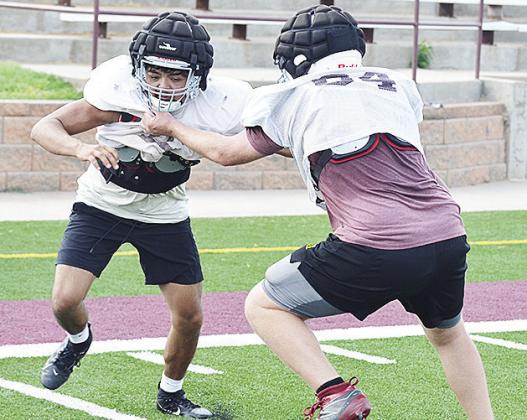 Alex Amaya, left, goes against Connor Richardson in a lineman drill during practice at the Tornado Bowl. CDN | Sam Goodwyn