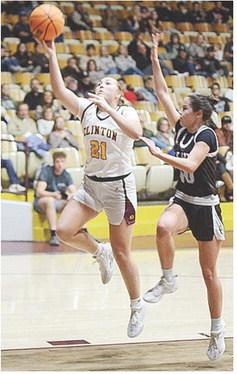 No. 21 Rhylee Rodebush goes up for a layup in front of Elk City’s Lucy O’Hara during Clinton’s game against the Elkettes Tuesday. CDN | Sam Goodwyn