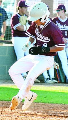 Clinton’s No. 9 Azreal Fierros crosses home plate for a run during the Reds’ home game Monday against Kingfisher. CDN | Sam Goodwyn