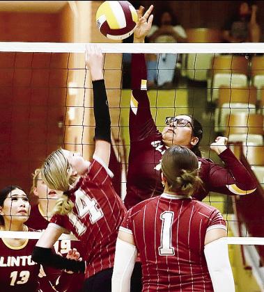Clinton Ayshka Garcia reaches high above the net to hit it over the opponent during the Lady Reds’ Senior Night game against Blair in the Tornado Dome. CDN | Keri Staggs