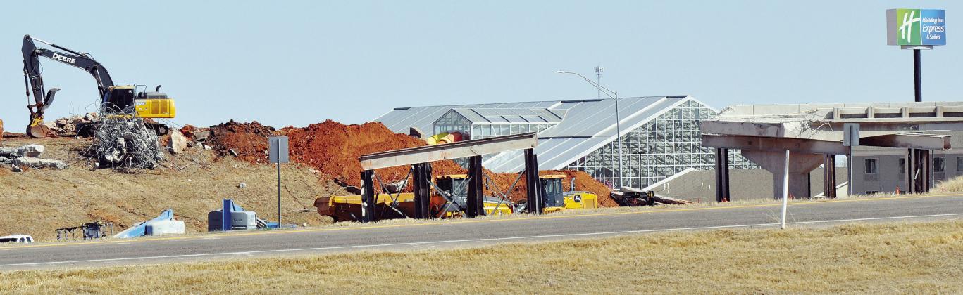 Only half a bridge remains during the demolition process involving Exit 65A. Demolition continues in the area in preparation of new structures to take their place. CDN | Staff Photo