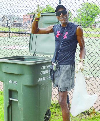Terry Fishback spent his Tuesday afternoon picking up trash near the basketball courts at McLain Rogers Park. He said he hopes more people will try and help keep the city clean. CDN | Micah Ashcraft