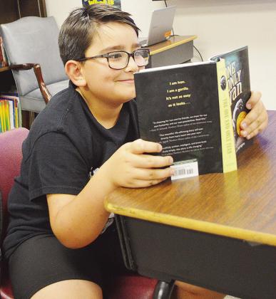 Paeton Eaton enjoys some quality reading time at Eastside Academy.