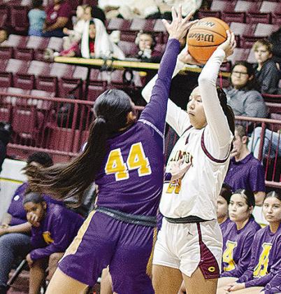 Clinton’s Ella Redshin looks for an open teammate during the Lady Reds’ game against Anadarko in the Tornado Dome. CDN | Sam Goodwyn