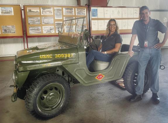 Sumer Jones and José González hang out in a vehicle at the space port painted by PAC after repainting an HMX helicopter for the National United States Armed Forces Museum in Houston. When the historicallyaccurate work was complete, according to Gonzále