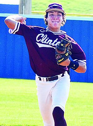 Clinton’s Easten Powell aims to throw the ball to first during the Reds’ summer game Monday in Arapaho. CDN | Sam Goodwyn
